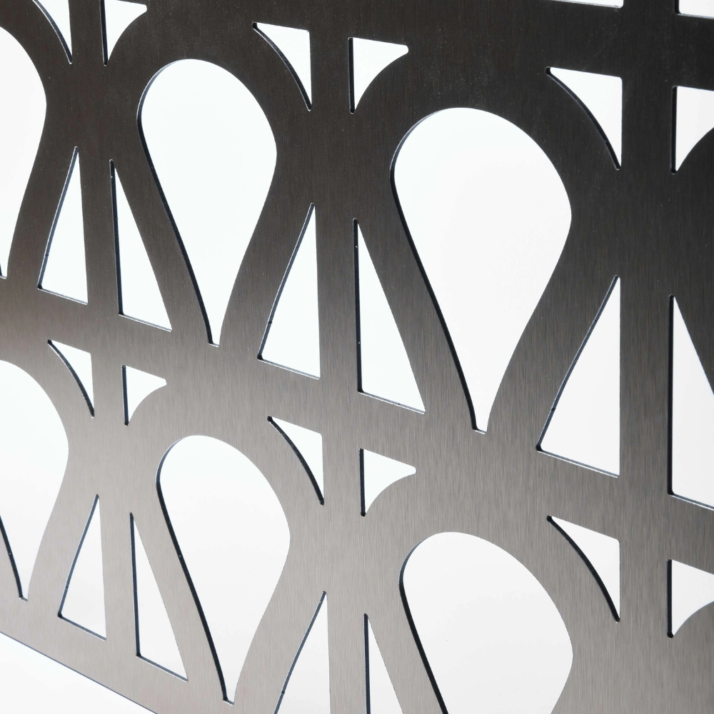 Metallic decorative screen with geometric cut-out patterns on a white background